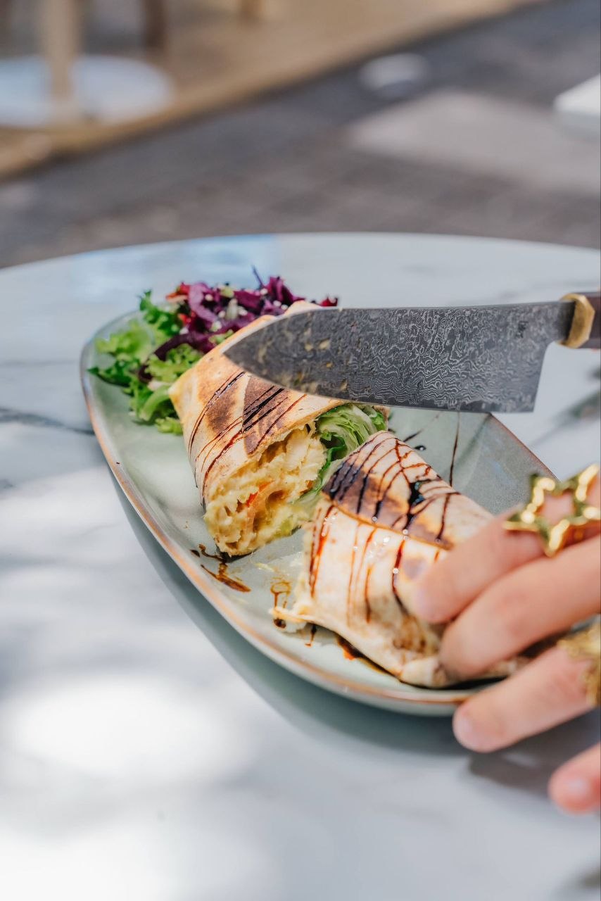 Coronation Chicken wrap — roast chicken, mango chutney mayo, tomatoes and lettuce.
