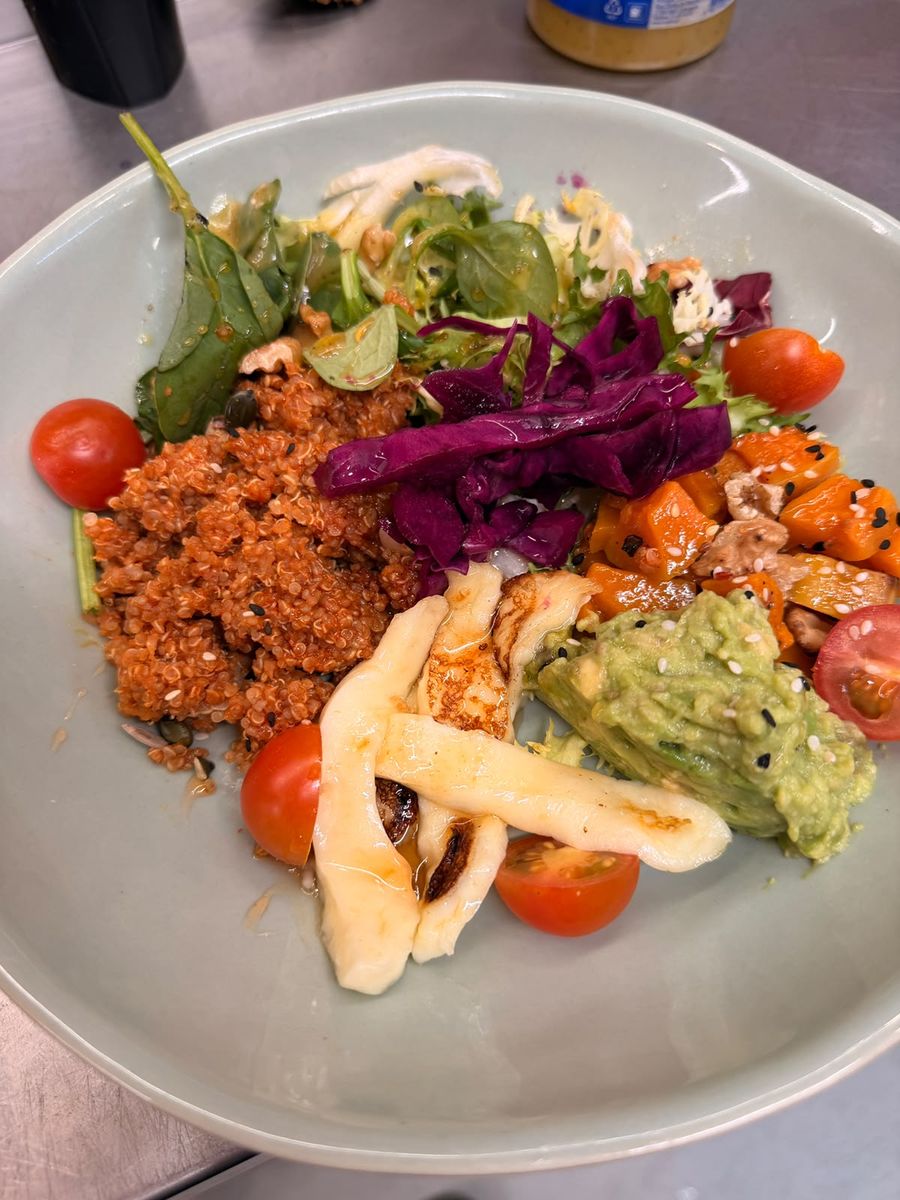 Hearty Sweet Heat bowl — greens, spinach, lemon quinoa, grilled halloumi, avocado, roasted butternut, tomatoes and walnuts with a hot honey drizzle.